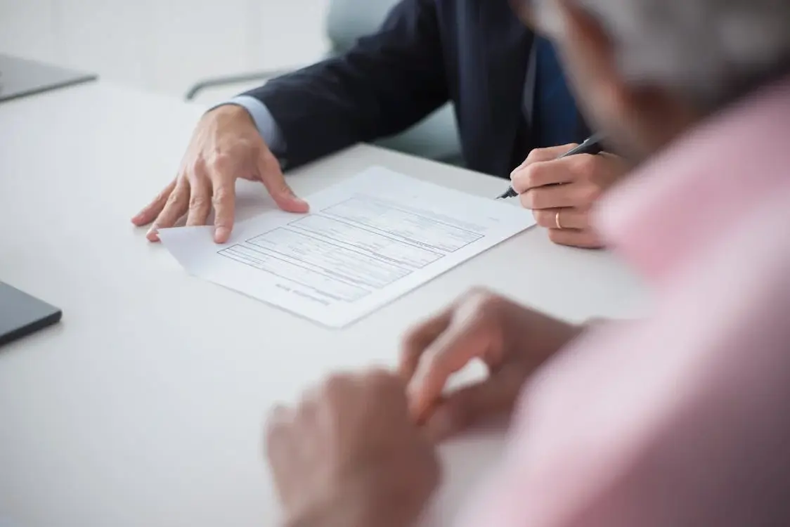 Man signing paperwork