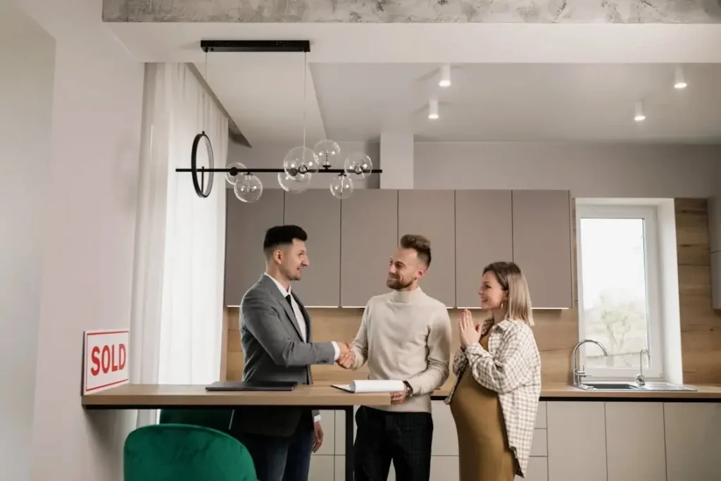 Buyers closing the deal with realtor