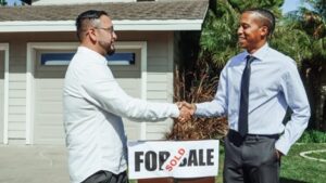 Two people closing on a home purchase.
