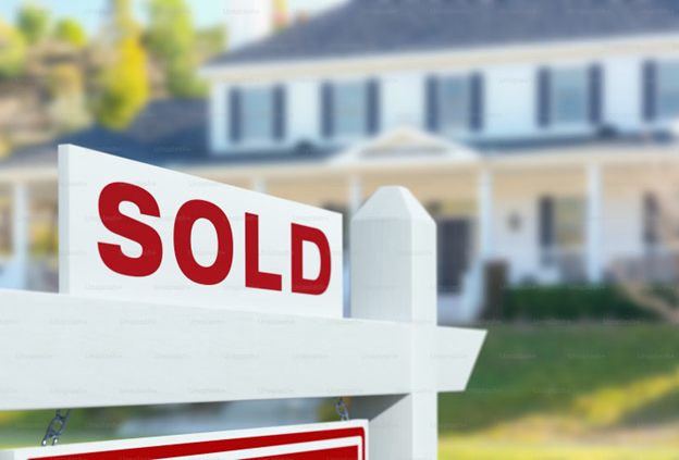 Sold sign in front of house